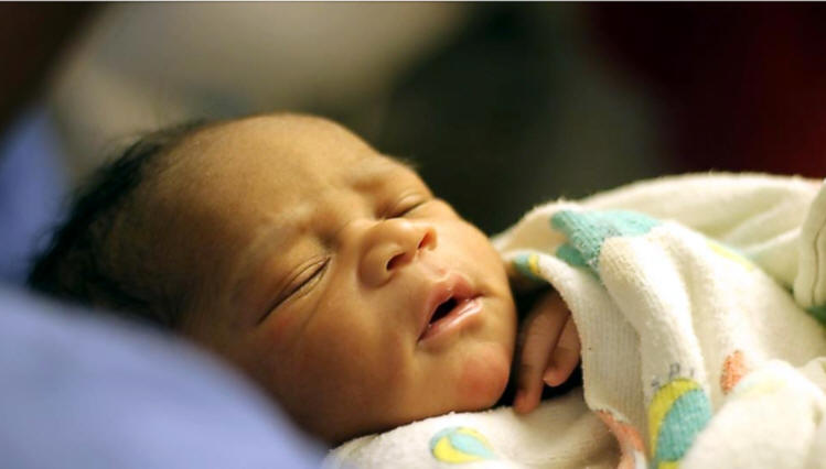 Noah just about 2 hours hold in the recover room with the family and maternal grandparents