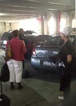 Marguerite and Leslie with Annick (Mom) and Barrington (Dad) arrives in the parking lot area on the third floor at 3:12 p.m.