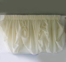 Cloud shade with pencil pleated heading raised